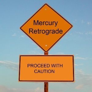 A sign that says mercury retrograde and proceed with caution.